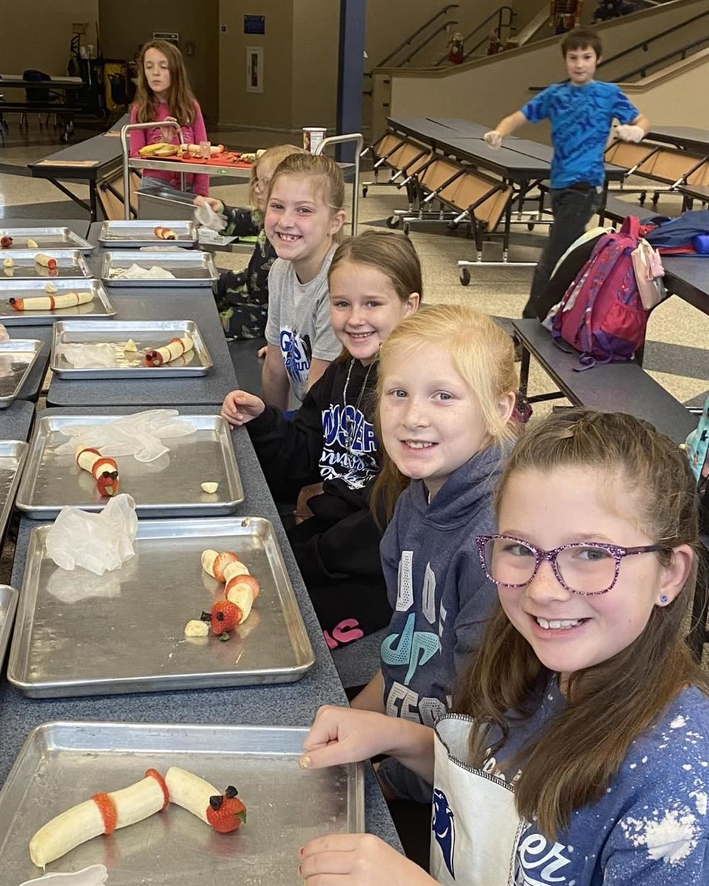 Students make fruit snakes during Friday Fun Day Clubs.